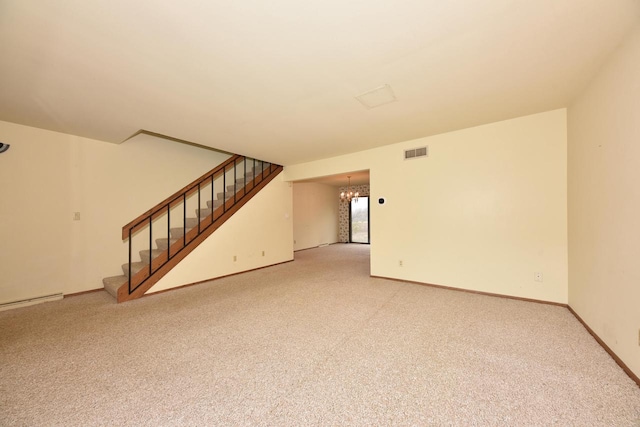 unfurnished room featuring light colored carpet and an inviting chandelier