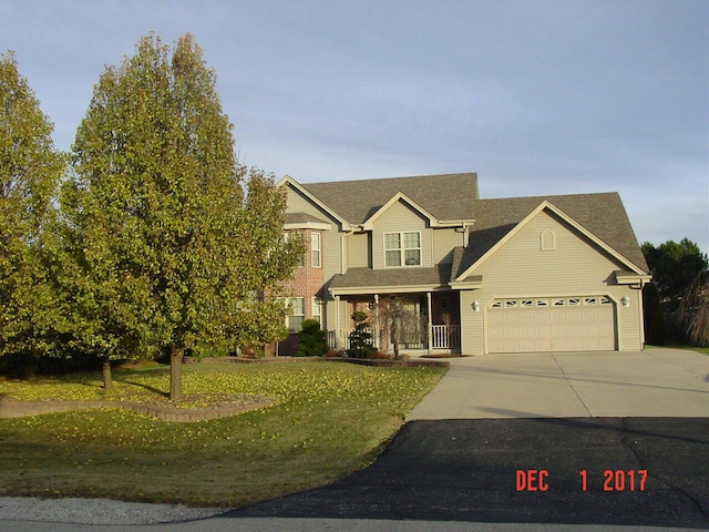 view of front facade with a garage and a front yard