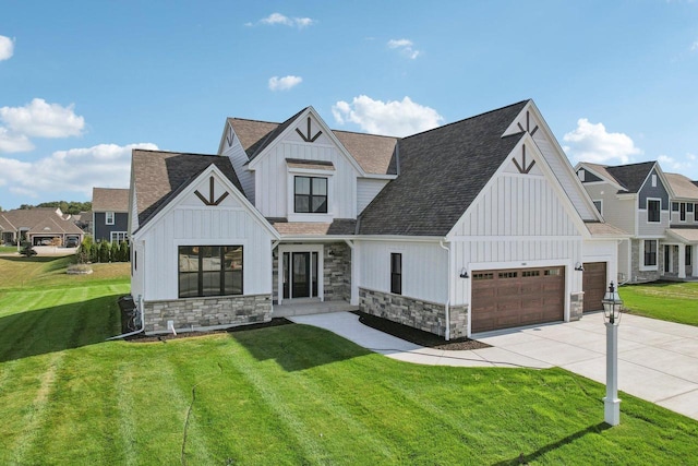 modern farmhouse with a garage and a front lawn