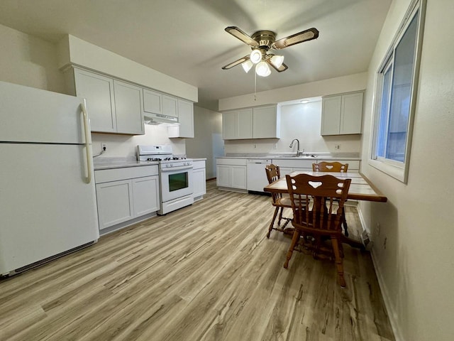 kitchen with white appliances, white cabinets, sink, light hardwood / wood-style flooring, and ceiling fan