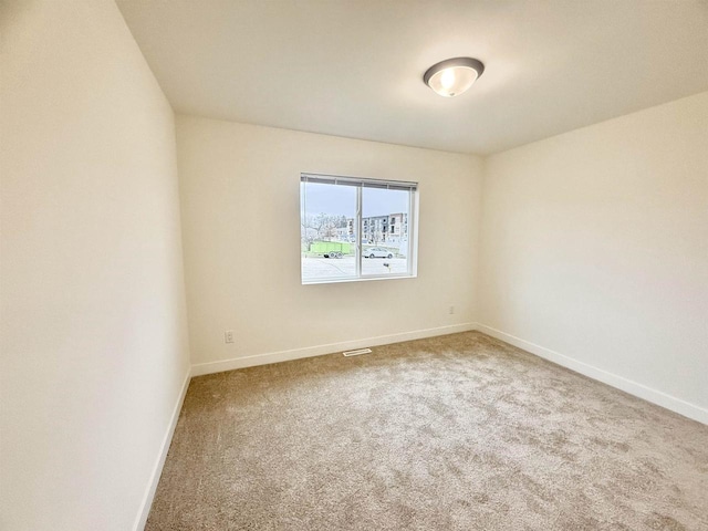 empty room featuring carpet floors