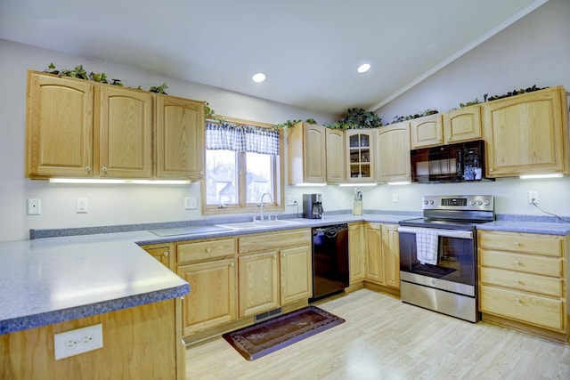 kitchen featuring light brown cabinets, black appliances, sink, vaulted ceiling, and light hardwood / wood-style floors