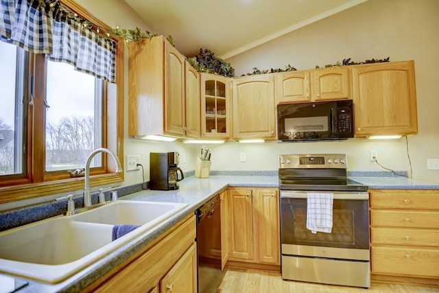 kitchen featuring light brown cabinets, lofted ceiling, black appliances, sink, and light hardwood / wood-style flooring