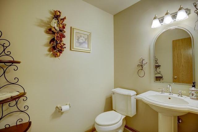 bathroom featuring sink and toilet