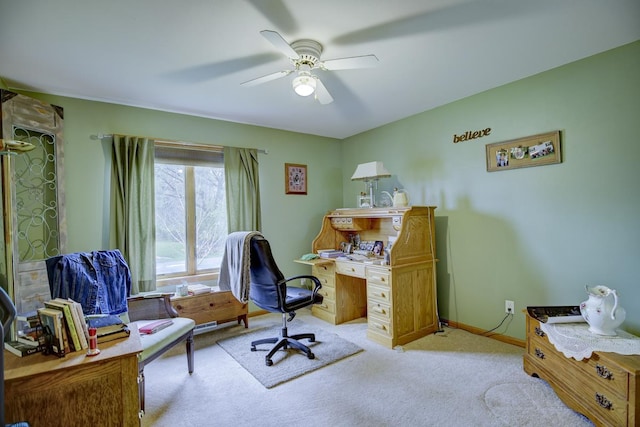 carpeted office with ceiling fan