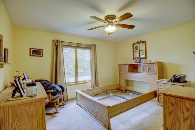 bedroom featuring light carpet and ceiling fan