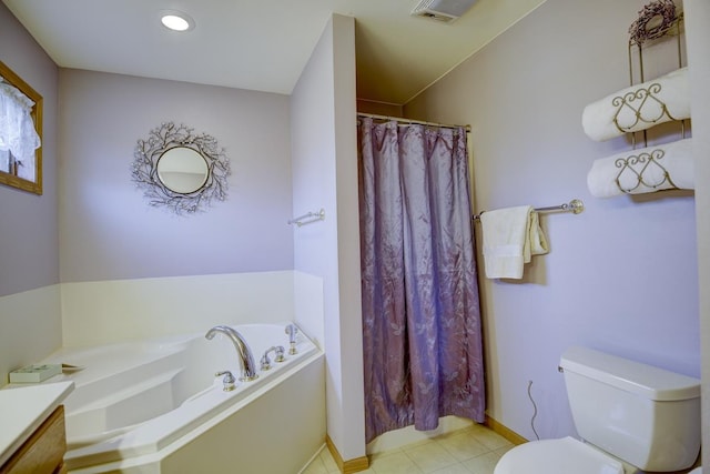 bathroom featuring tile patterned flooring, vanity, toilet, and a bathing tub