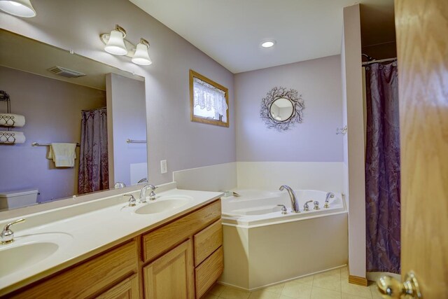 bathroom with vanity, toilet, and a bathing tub