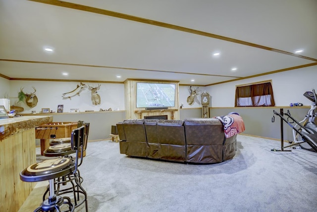 living room with crown molding, a fireplace, and light carpet