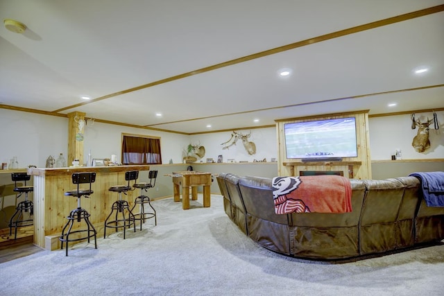 living room with light colored carpet, ornamental molding, and bar