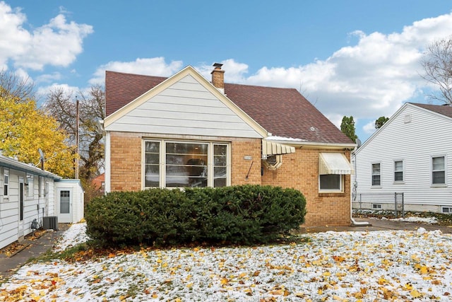 back of house featuring central AC unit