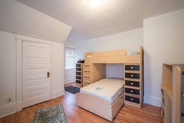 bedroom with wood-type flooring