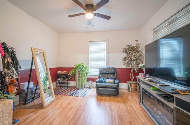 interior space with ceiling fan and light hardwood / wood-style floors