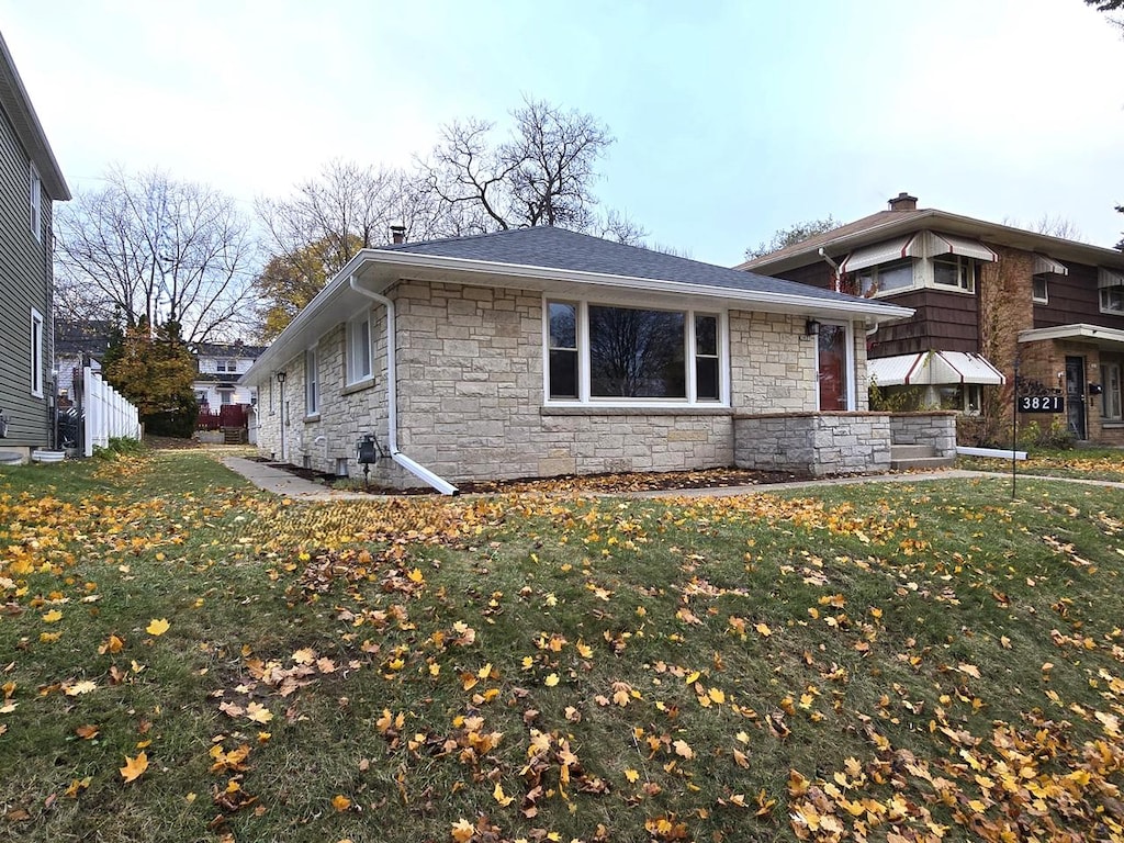 view of property exterior featuring a yard