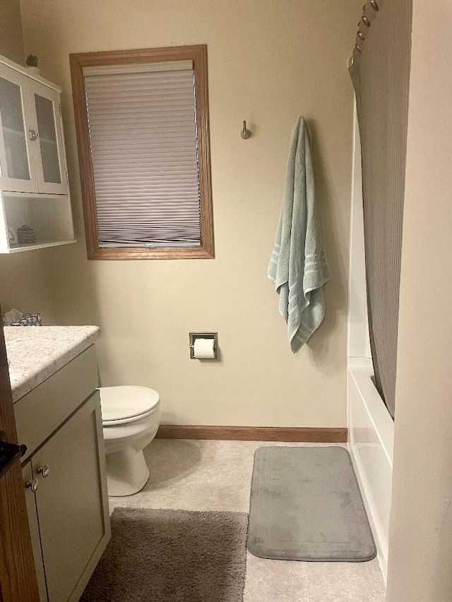 full bathroom with washtub / shower combination, vanity, and toilet