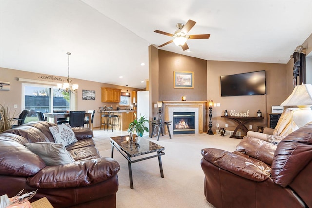 living room with ceiling fan with notable chandelier, light colored carpet, a wall mounted AC, and vaulted ceiling