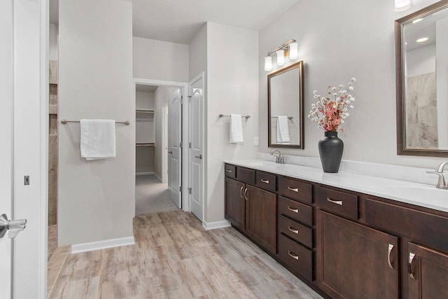 bathroom featuring vanity and hardwood / wood-style flooring