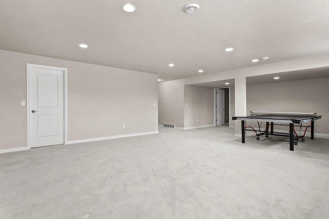 recreation room with light carpet