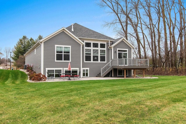 back of house with a yard, a deck, a patio area, and central air condition unit