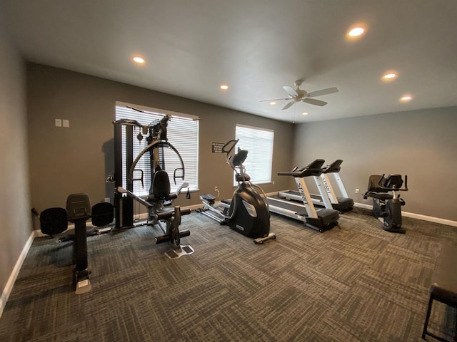 workout room with dark colored carpet and ceiling fan