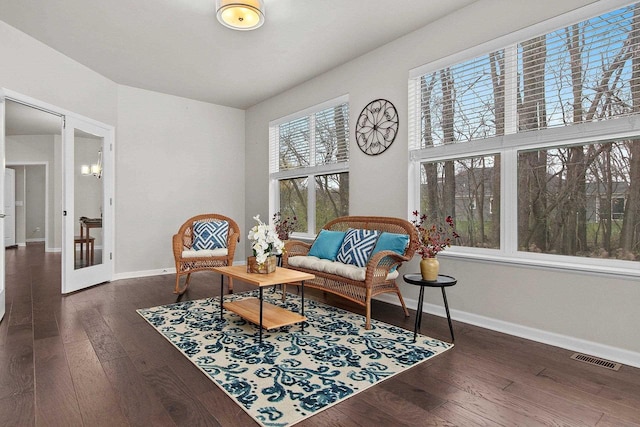 living area with dark hardwood / wood-style flooring