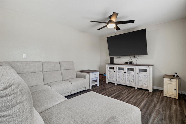 living room with ceiling fan and dark hardwood / wood-style flooring