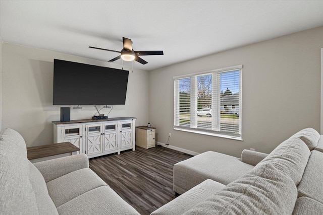 living room with dark hardwood / wood-style floors and ceiling fan