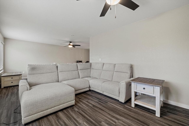 living room with ceiling fan and dark hardwood / wood-style floors