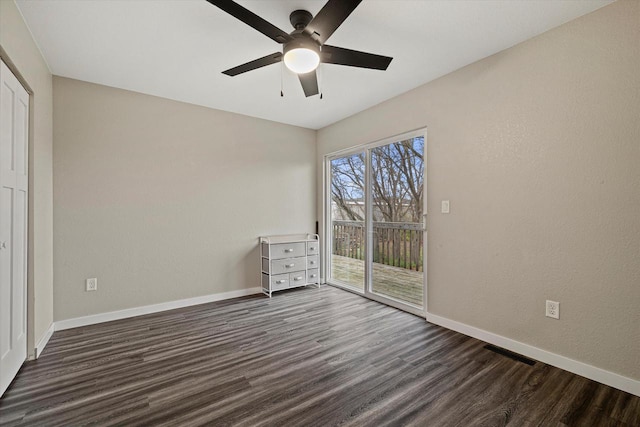 unfurnished bedroom featuring access to outside, ceiling fan, and dark hardwood / wood-style floors