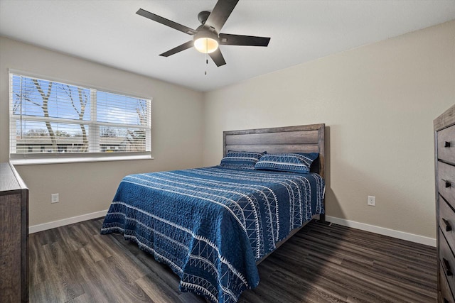 bedroom with dark hardwood / wood-style floors and ceiling fan