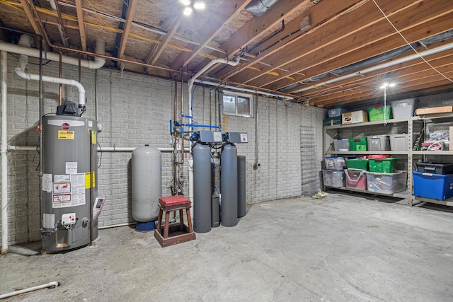 basement with brick wall and water heater