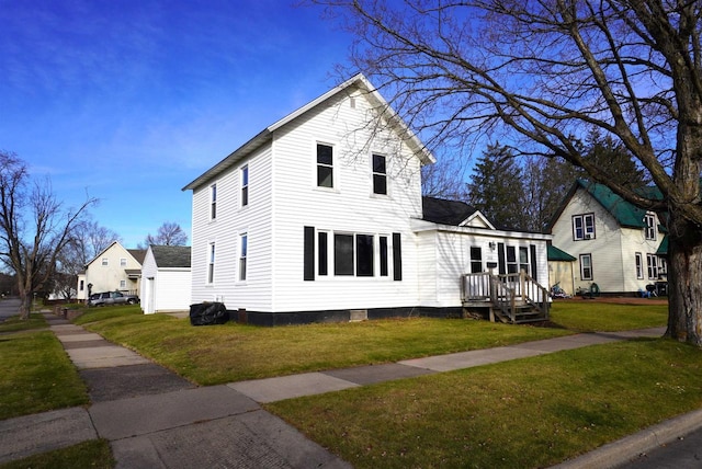 view of front of home with a front yard