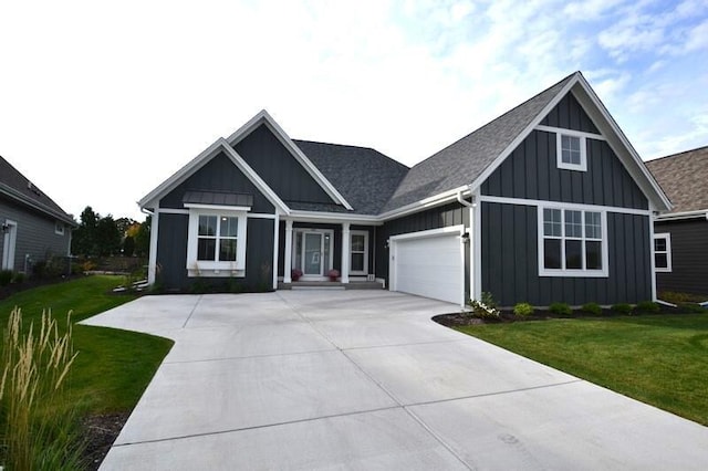 view of front facade with a garage and a front yard