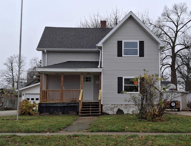 view of front of house featuring covered porch and a front yard