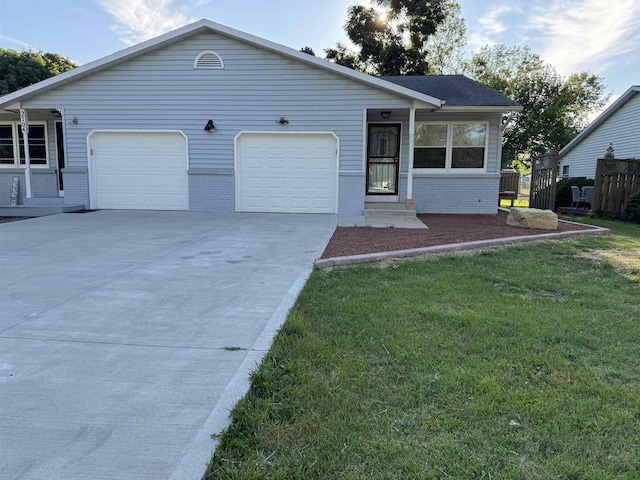 view of front of house featuring a garage and a front lawn