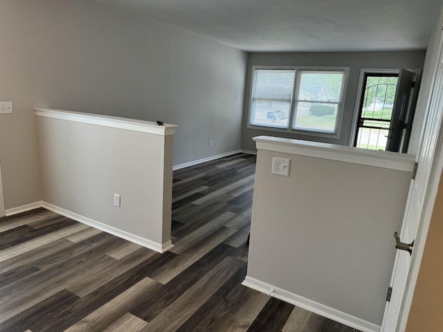 spare room with dark hardwood / wood-style floors