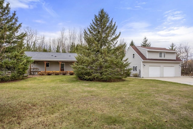 view of front of property featuring a garage and a front yard