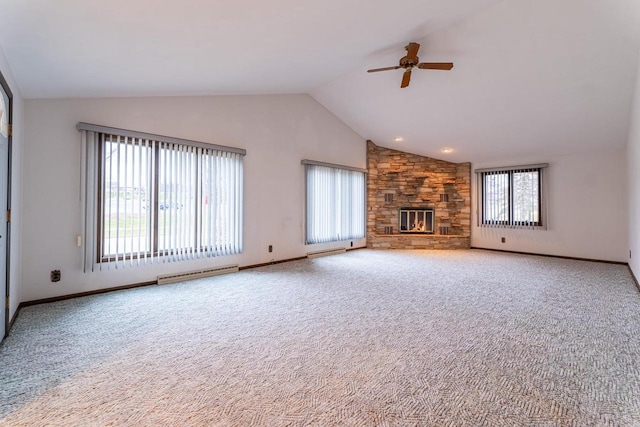 unfurnished living room with carpet flooring, a wealth of natural light, and vaulted ceiling