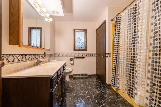 bathroom with vanity, toilet, plenty of natural light, and tile walls