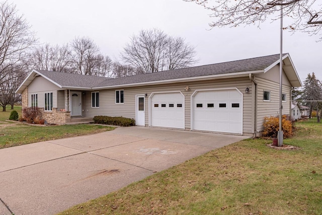 single story home featuring a garage and a front lawn