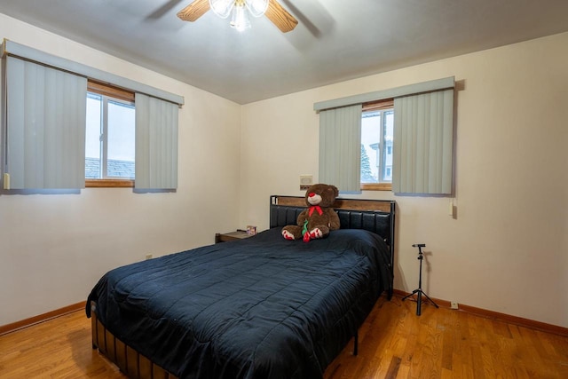 bedroom featuring hardwood / wood-style floors and ceiling fan