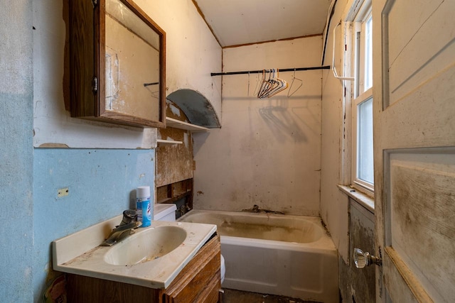 bathroom featuring a bath and vanity