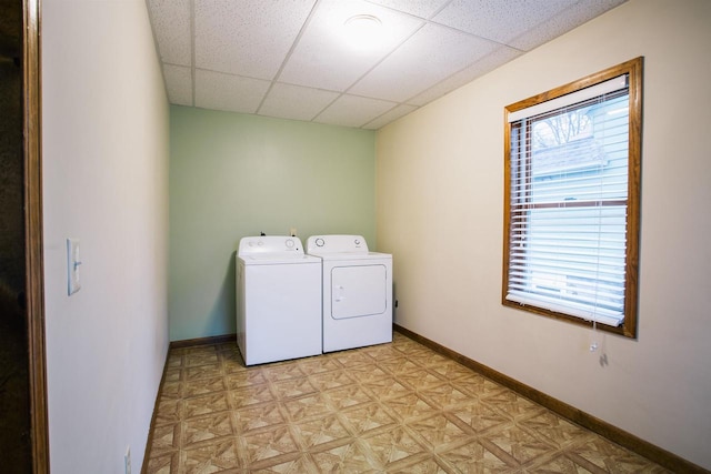 laundry area with washer and dryer and light parquet floors