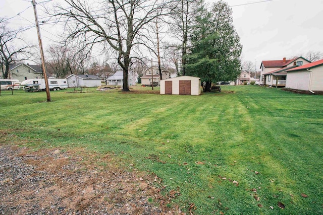 view of yard with a storage shed