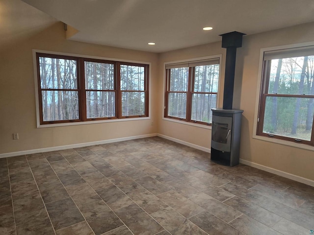 spare room with a wood stove