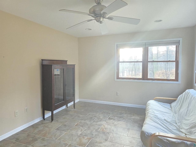 sitting room featuring ceiling fan