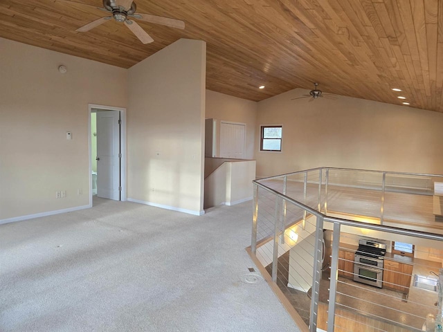 interior space with ceiling fan, wood ceiling, and vaulted ceiling