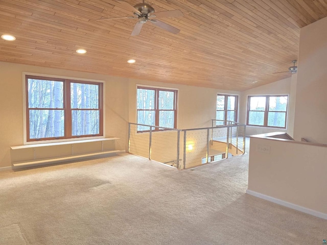 carpeted spare room featuring wooden ceiling, ceiling fan, and lofted ceiling