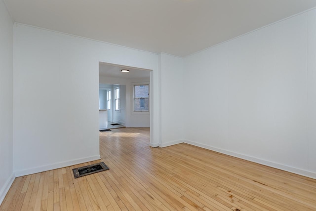 spare room with light hardwood / wood-style floors