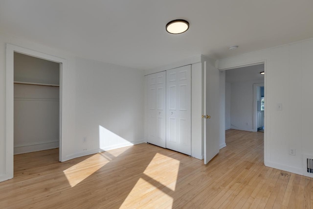 unfurnished bedroom with light hardwood / wood-style flooring